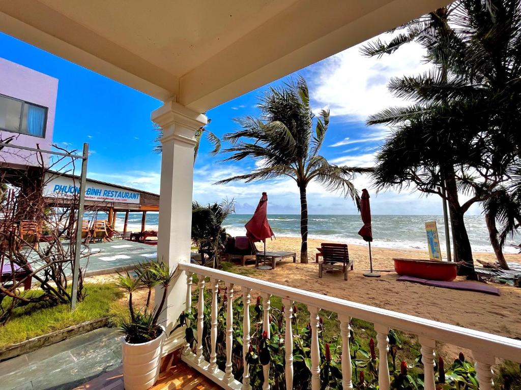 Sun loungers on the sand at the water's edge
