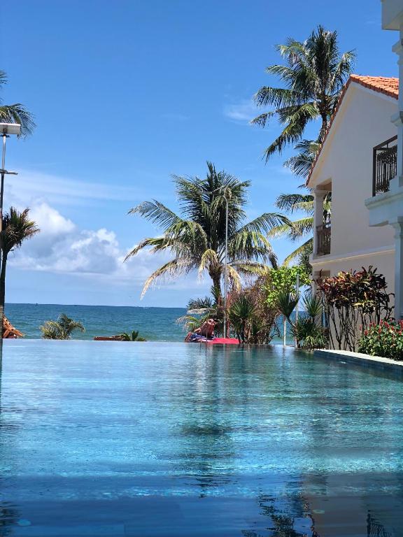 Poolside loungers among tropical planting